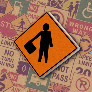 Оранжевый ромб с черным силуэтом человека, держащего флаг. Знак "Traffic control person ahead" предупреждает о регулировщике на участке дорожных работ